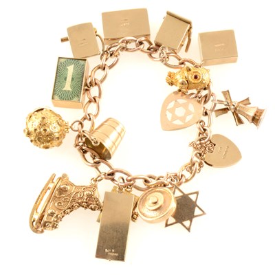 Lot 272 - A gold charm bracelet and charms, total gross weight approximately 66.3gms.