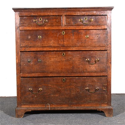 Lot 602 - A George III walnut chest of drawers,...