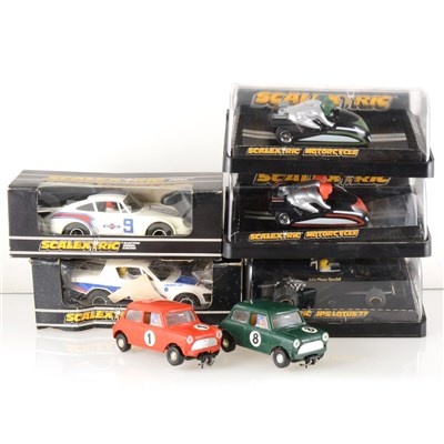 Lot 176 - Scalextric slot-car racing; seven model cars and motorbikes, with track.
