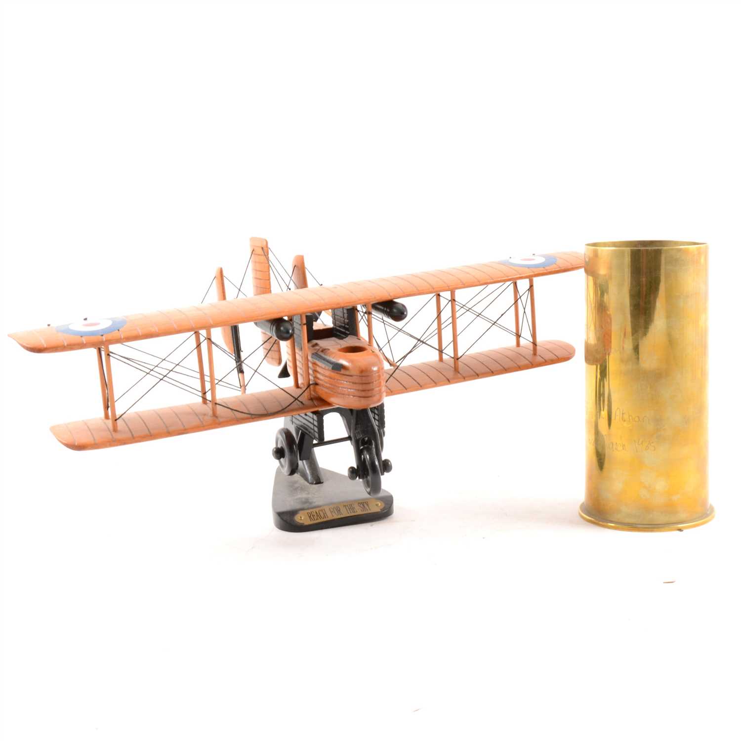 Lot 97 - Brass aircraft engine starter cartridge No. 10 Mk.3 RLB83/7, pair of RAF napkin rings, wooden model bi-plane "Reach For The Sky", sword in scabbard.