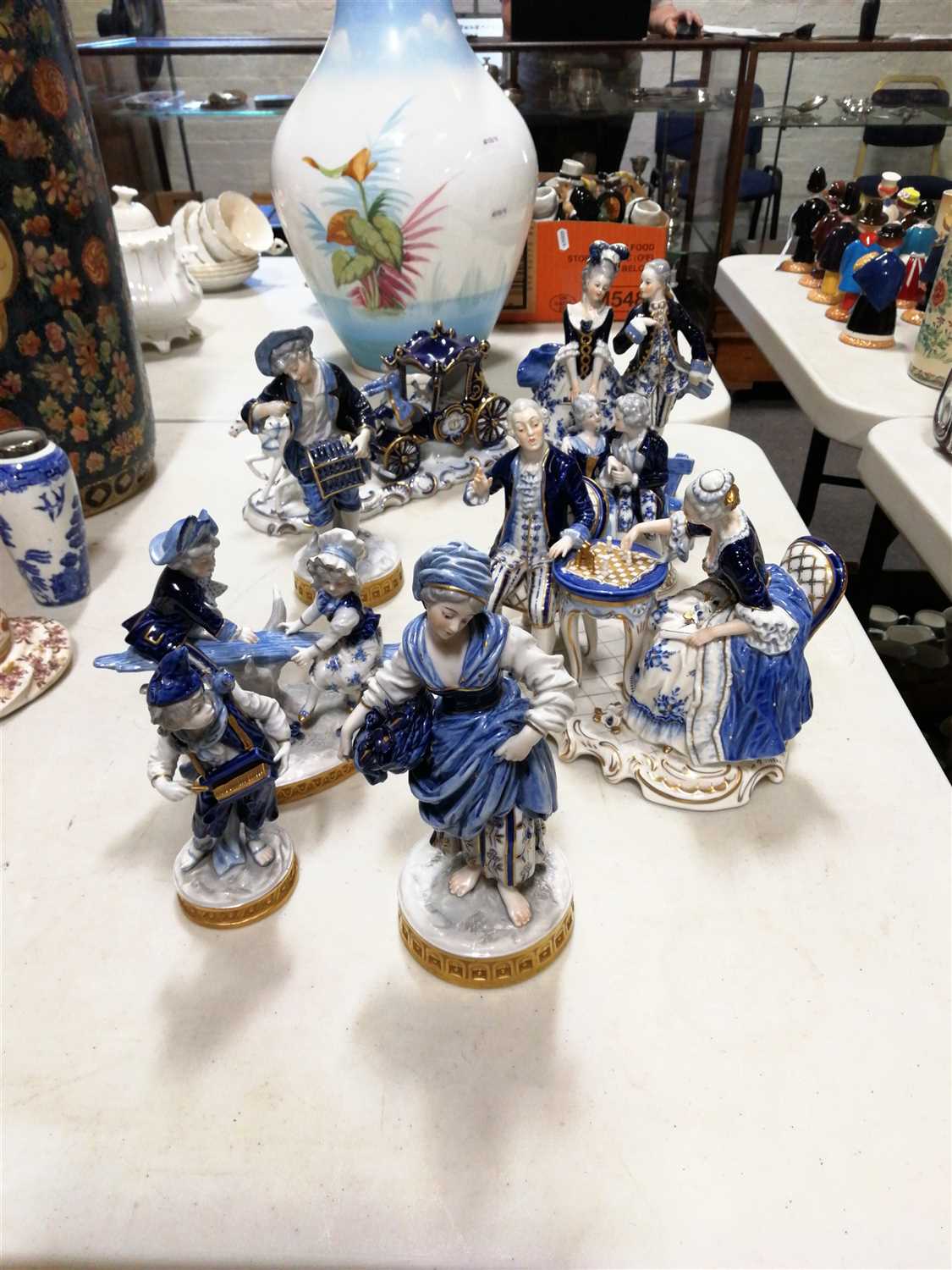Lot 31 - Dresden style porcelain figures, including coaches and horses, pair playing chess, courting couples, etc, (8)