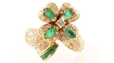 Lot 271 - An emerald and diamond fancy floral design cluster ring.