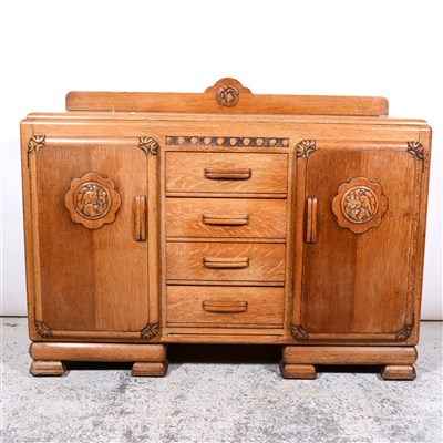 Lot 310 - 1930s oak dining suite, comprising sideboard, six chairs, draw-leaf table.