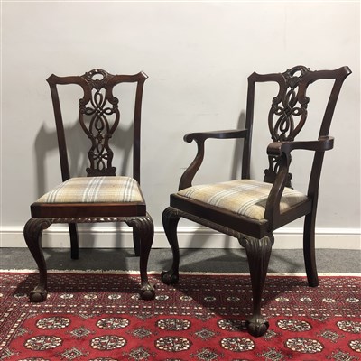 Lot 310 - A set of six reproduction Chippendale inspired dining chairs