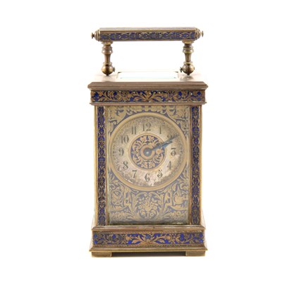 Lot 83 - An enamelled brass carriage clock