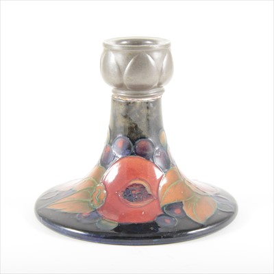 Lot 38 - A 'Pomegranate' pottery candlestick with pewter sconce, by William Moorcroft, circa 1920.