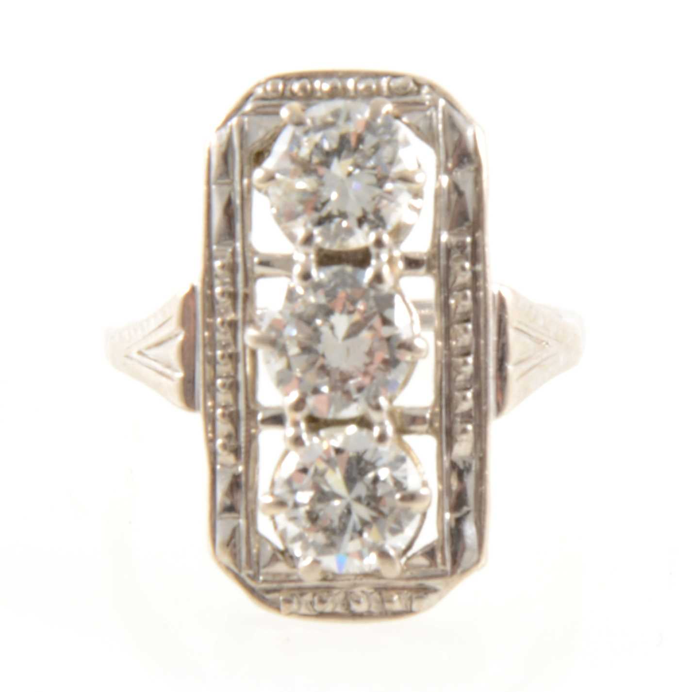 Lot 185 - A diamond three stone ring in the Art Deco style