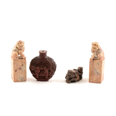 Lot 76 - Chinese cinnabar flask shape snuff bottle, a pair of soapstone scroll-weights, and a netsuke.