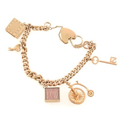 Lot 274 - A 9 carat yellow gold charm charm bracelet with charms