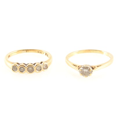 Lot 242 - Two diamond rings, a solitaire and a five stone.
