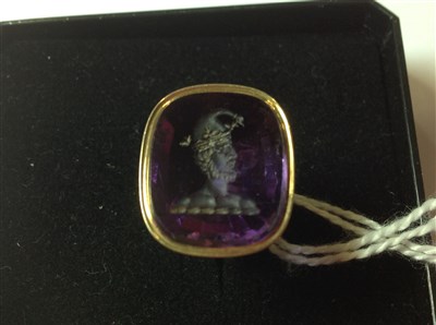 Lot 282 - A yellow metal seal with intaglio carved amethyst to base depicting a jester.