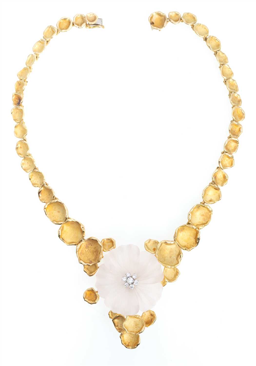 Lot 234 - A 1970's 18 carat gold necklace with diamond set rose quartz flower.