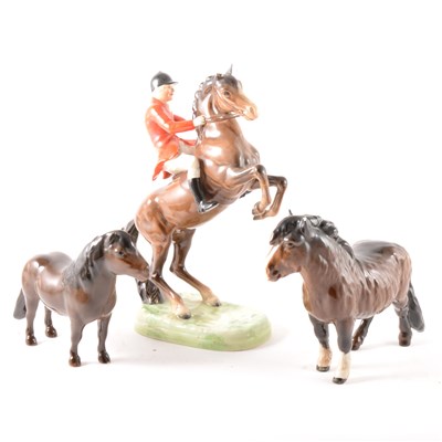 Lot 119 - A Beswick model of Huntsman on rearing horse ...