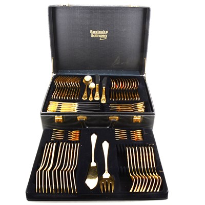 Lot 170 - A cased canteen of gold plated cutlery, by Bestecke Solingen, Wien pattern