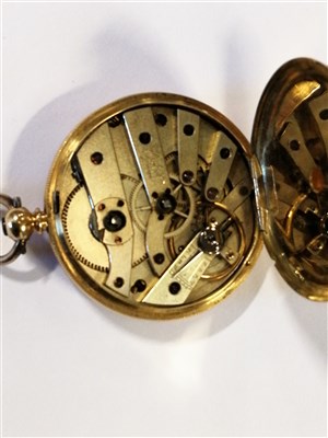 Lot 431 - An 18K open face fob watch.