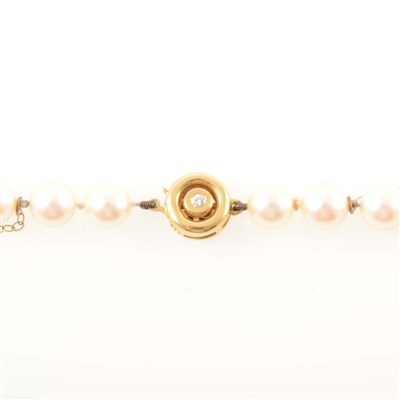 Lot 232 - A cultured pearl necklace with diamond fastener.