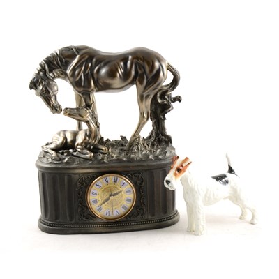 Lot 154 - A silvered resin mantel clock, with horse and foal; and a Doulton Terrier figure