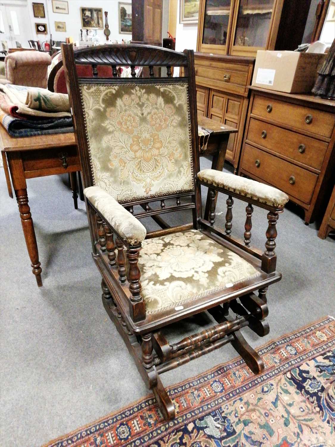 Lot 564 - An American stained wood rocking chair, ...