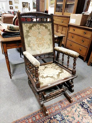 Lot 564 - An American stained wood rocking chair, ...