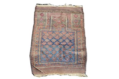 Lot 514 - A small Beluchi rug