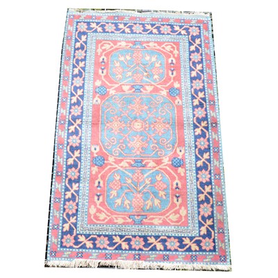 Lot 522 - A small modern Persian rug, three blue medallions