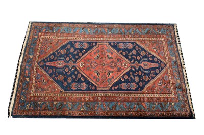 Lot 525 - A Hamadan rug, red ground