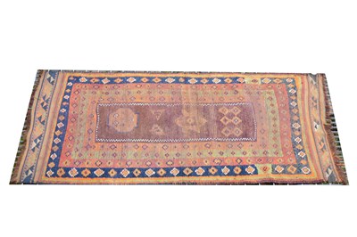 Lot 489 - A Belouch rug, central red ground panel