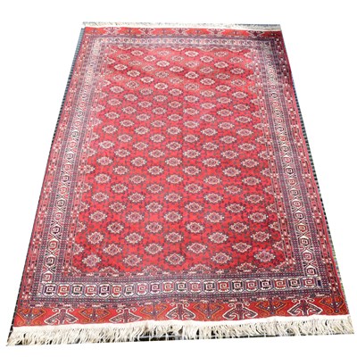 Lot 479 - A small Persian carpet, deep red ground, ...