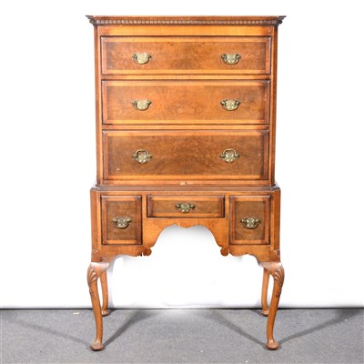 Lot 483 - A reproduction walnut finish chest on stand