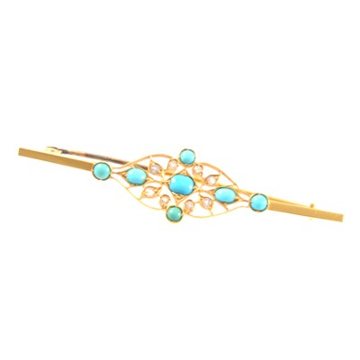 Lot 219 - An Indian yellow metal brooch with seven turquoises and eight synthetic white stones