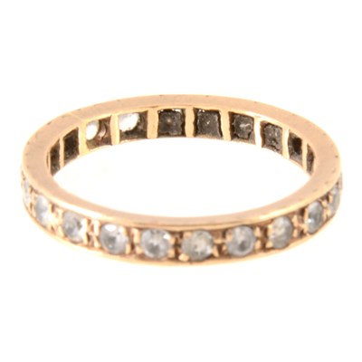 Lot 386 - A synthetic white spinel full eternity ring.