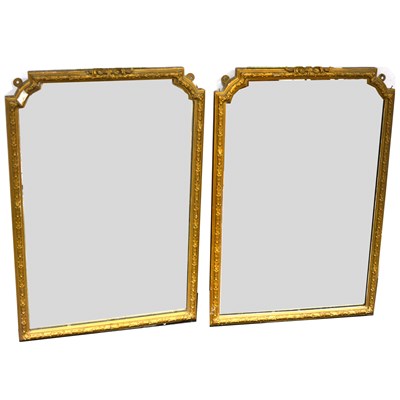 Lot 408 - A pair of gilt gesso framed pier glasses