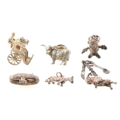 Lot 232 - A collection of silver charms