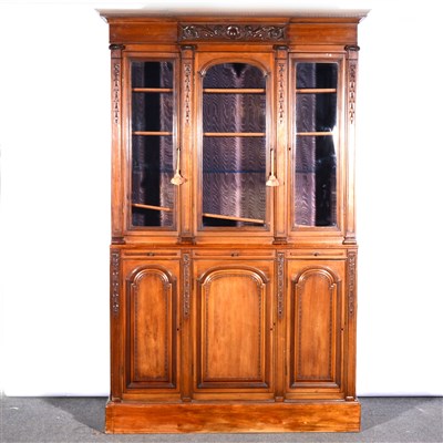 Lot 531 - A Continental walnut triple bookcase, ...