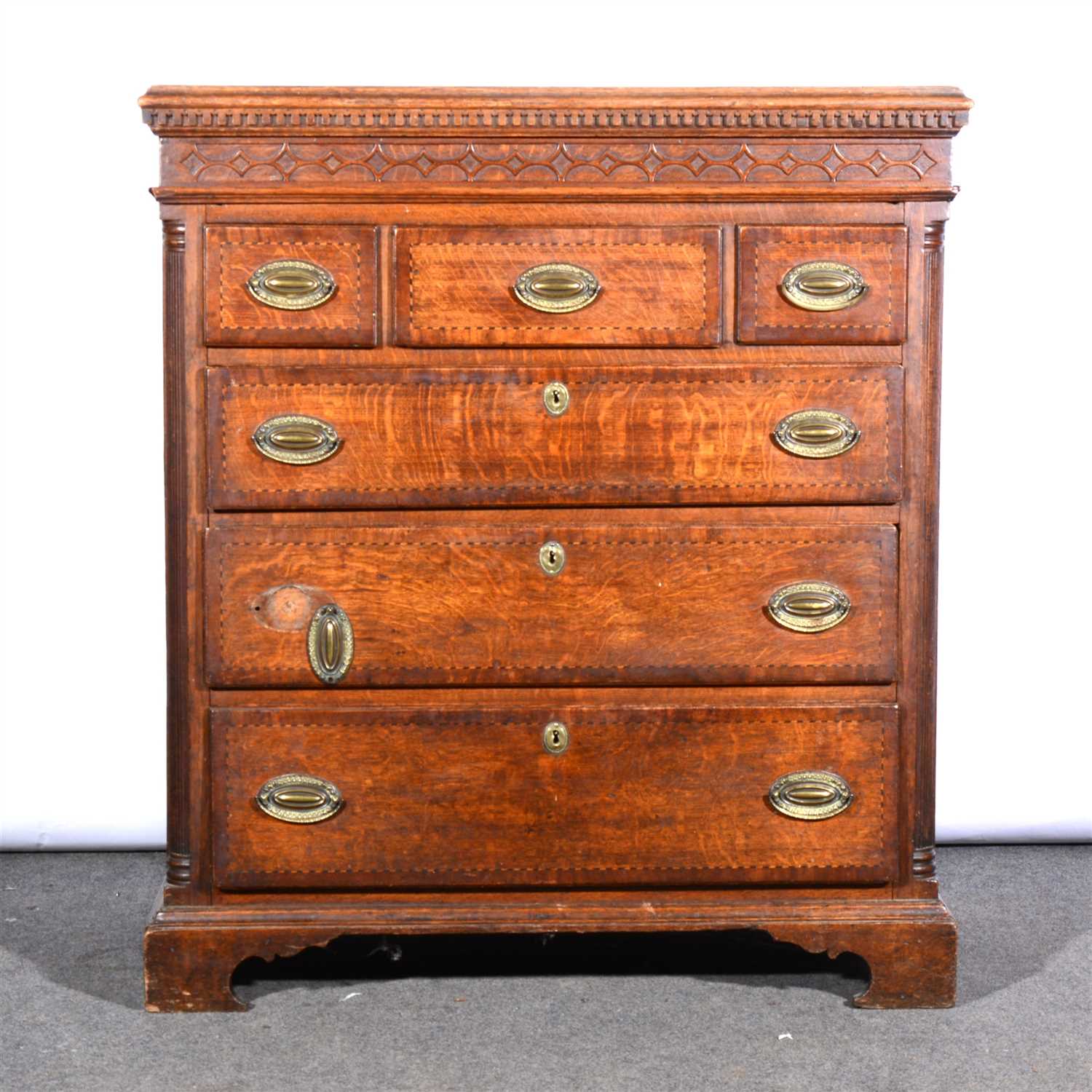 Lot 490 - A George III oak chest of drawers, adapted