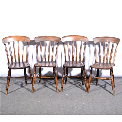 Lot 460 - A set of four stained beechwood lath-back kitchen chairs, ...