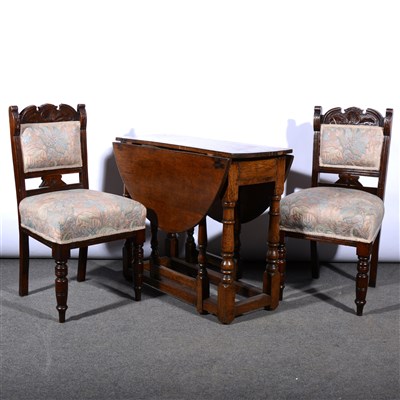 Lot 629 - Joined oak table and a set of four Victorian walnut dining chairs.