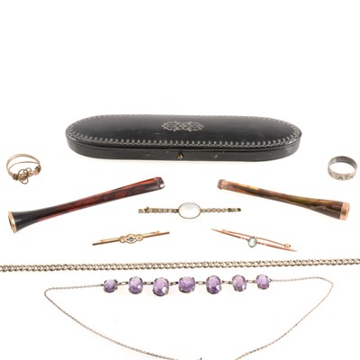 Lot 411 - Three cigarette holders, spectacle case and jewellery.