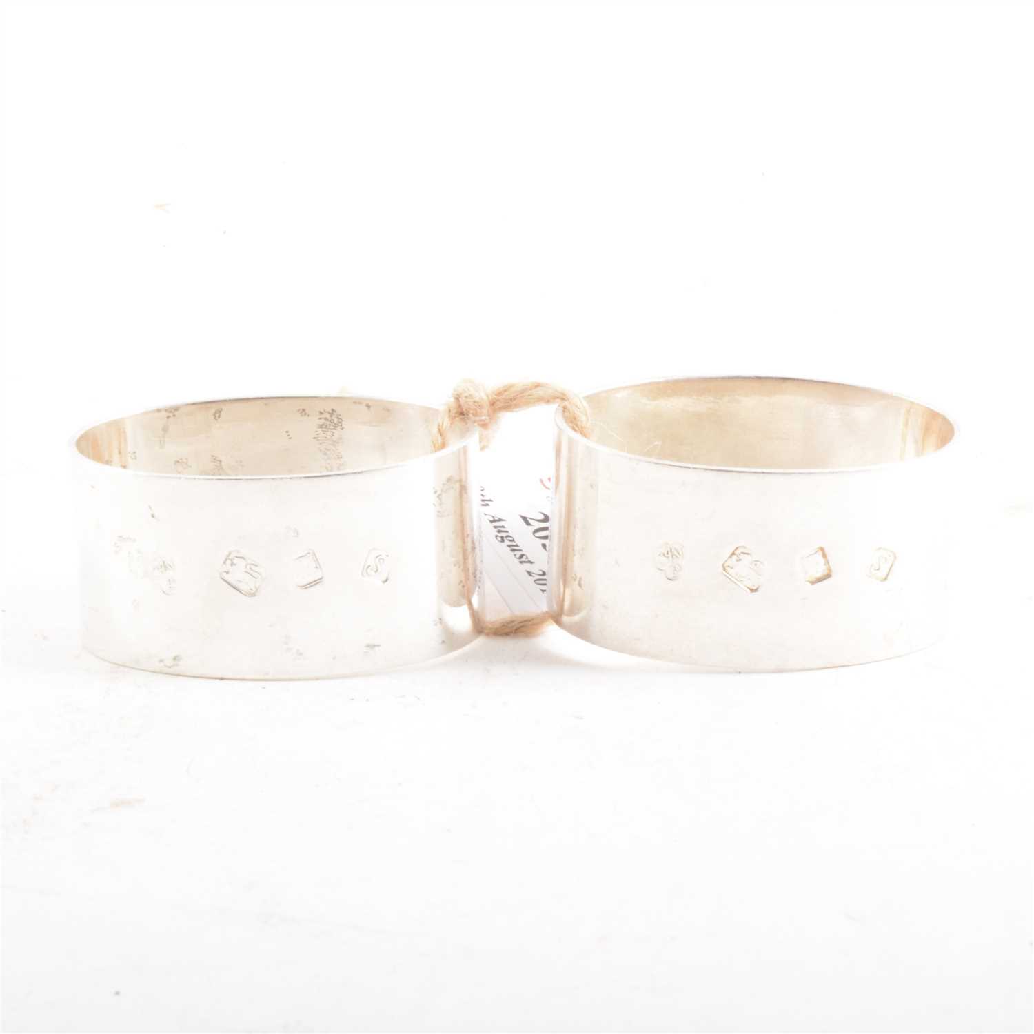 Lot 205 - A pair of silver napkin rings by C J Vander Ltd