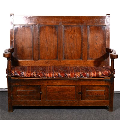 Lot 468 - A joined oak settle, four panelled back