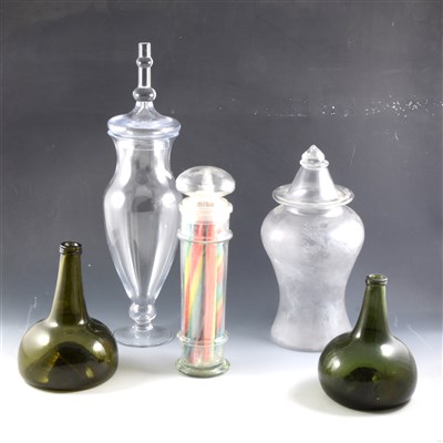 Lot 46 - Two olive green glass onion-shape decanters, and three glass jars