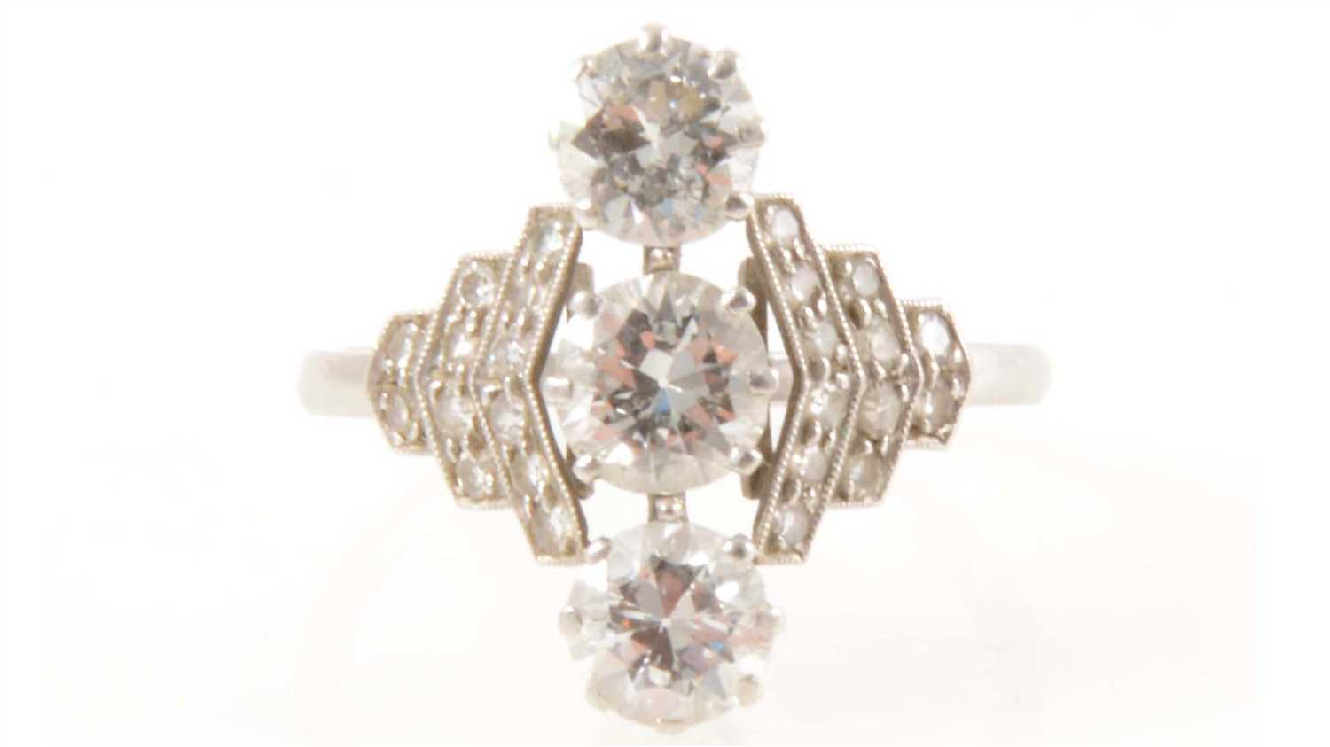 Lot 186 - A diamond three stone ring in the Art Deco style