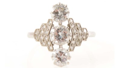 Lot 186 - A diamond three stone ring in the Art Deco style