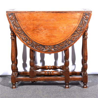 Lot 408 - Carved oak gateleg table