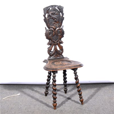 Lot 664 - A carved oak hall chair