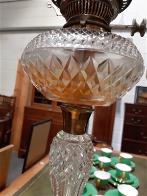 Lot 60 - A cut-glass oil lamp