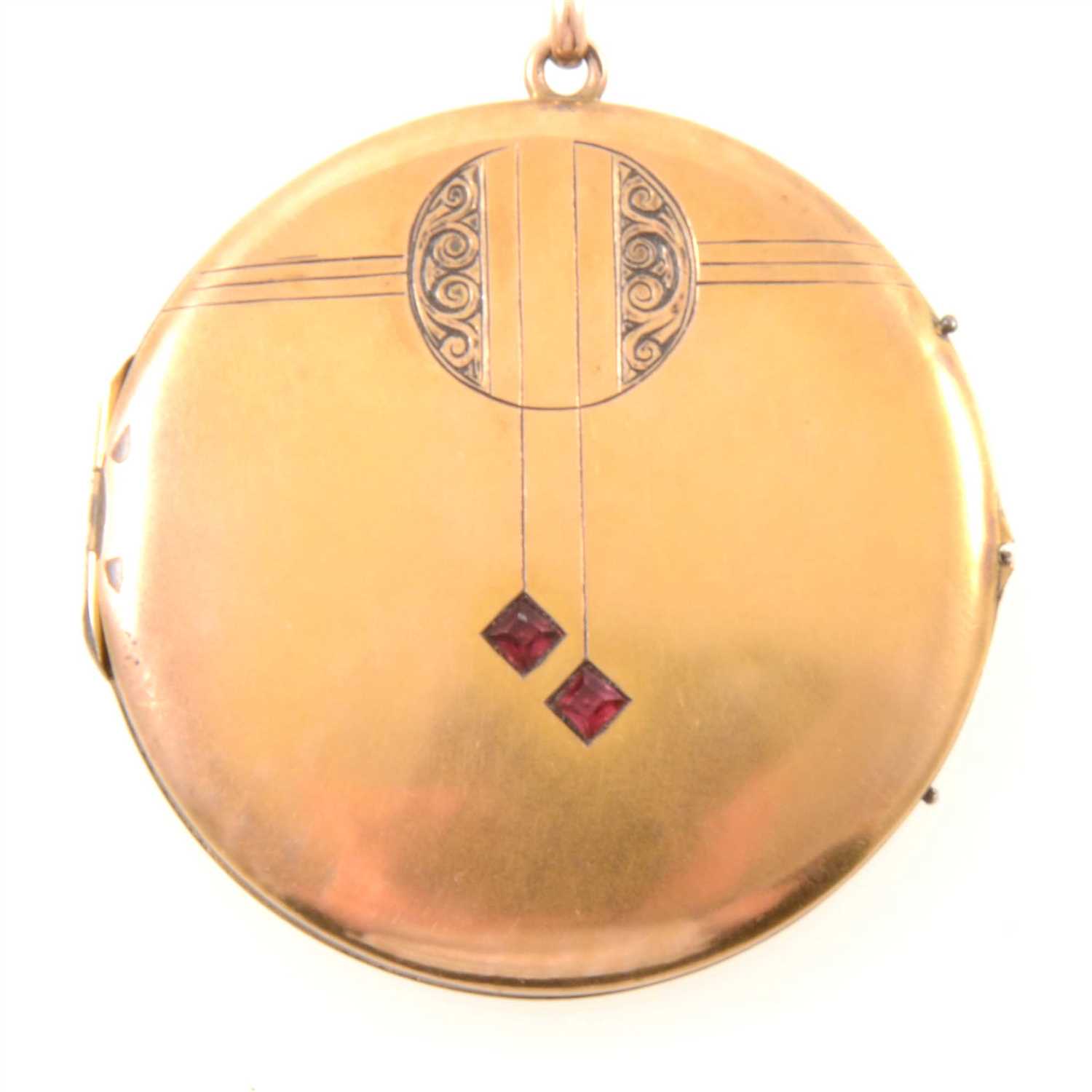Lot 223 - A yellow metal locket and chain in the Art Deco style.