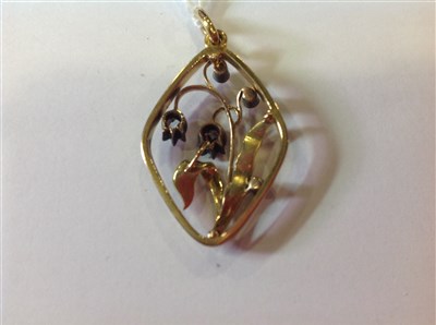 Lot 220 - A diamond set floral pendant.