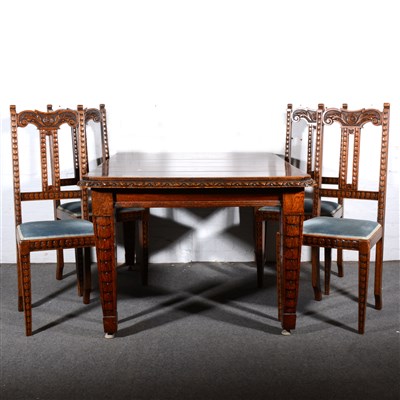 Lot 601 - A set of six Edwardian carved oak dining chairs, and a matching dining table