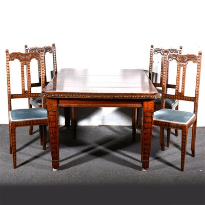 Lot 601 - A set of six Edwardian carved oak dining chairs, and a matching dining table